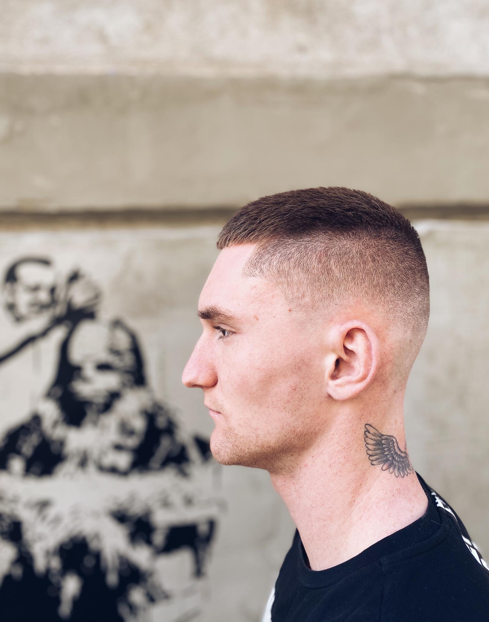 High skin fade with short crop on top, cut at American Barbershop Zagreb